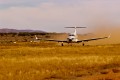 A Pilatus PC-12 converted into an air ambulance for the Royal Flying Doctor Service on an unsurfaced runway in Kulgera.