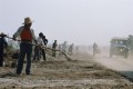 Road workers near Zhengzhou/Kaifeng, China.