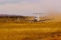 A Pilatus PC-12 converted into an air ambulance for the Royal Flying Doctor Service on an unsurfaced runway in Kulgera.